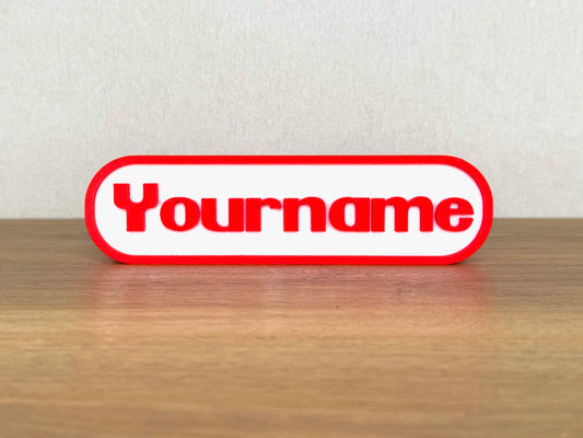 Picture of a Nintendo video game name sign on a desk or bedroom table