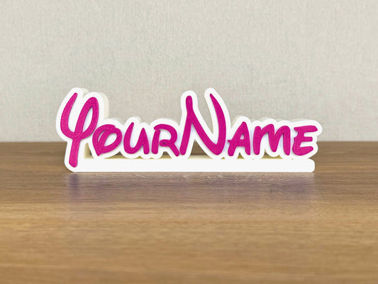 Picture of a disney name sign on a desk or bedroom table