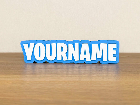 Picture of a fortnite video name sign on a wooden desk or bedroom table