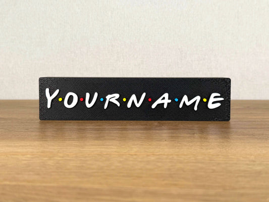 Picture of a friends sitcom name sign on a desk or bedroom table