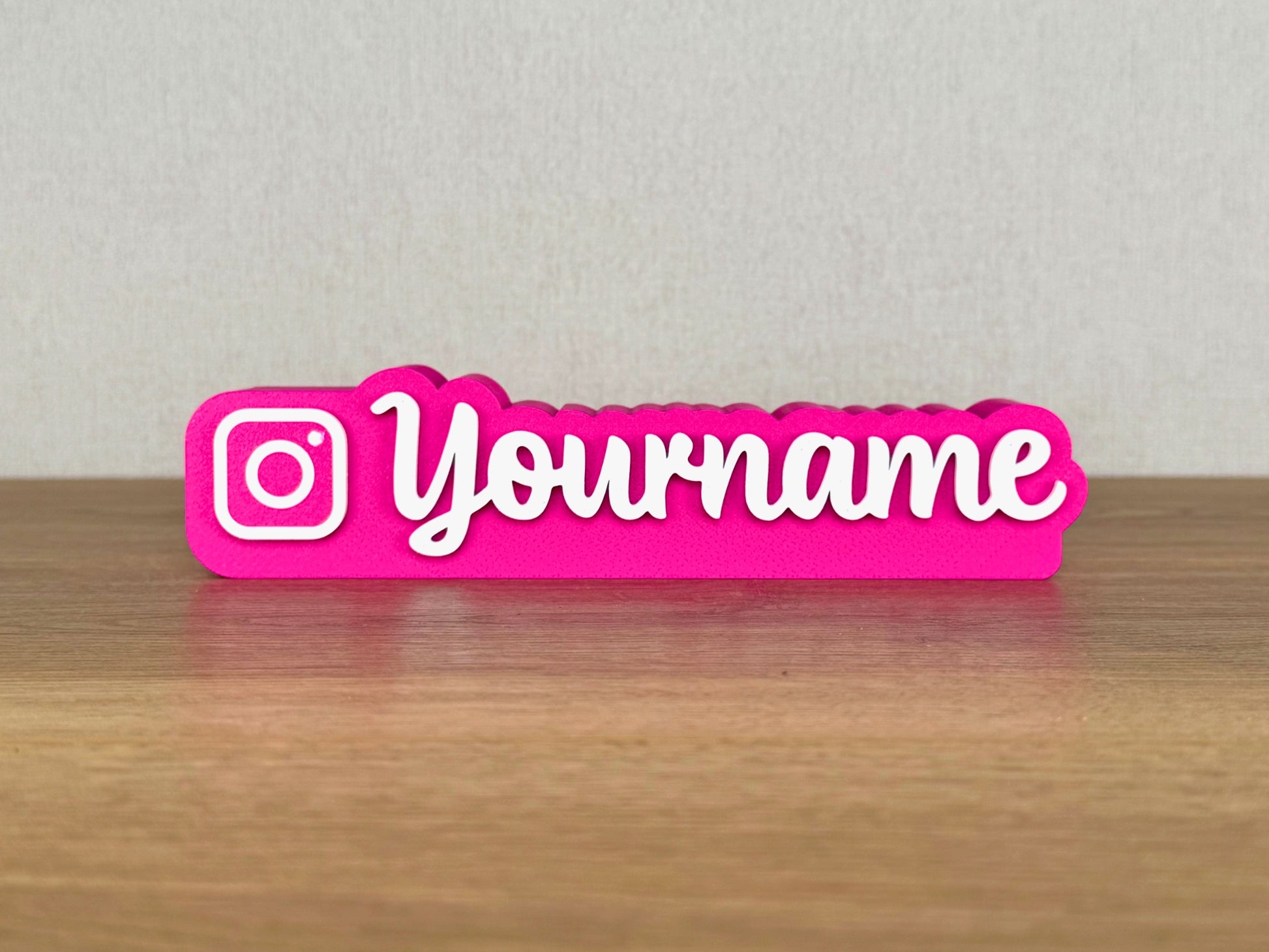 Picture of an instagram influencer or content creator name sign on a desk or bedroom table