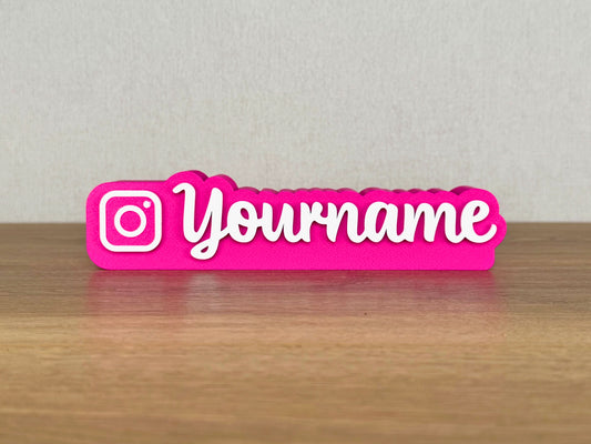 Picture of an instagram influencer or content creator name sign on a desk or bedroom table