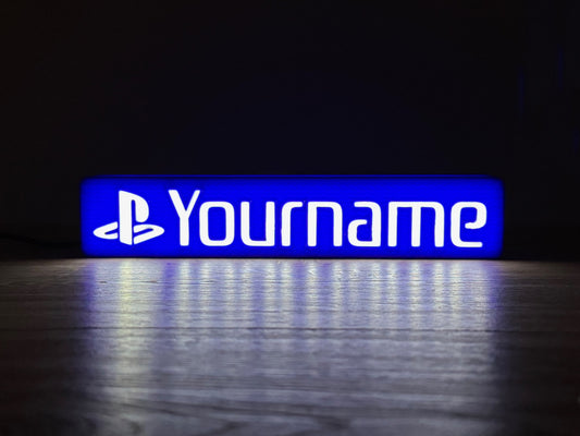 A picture of an illuminated LED lightbox in playstation style lighting up the darkness