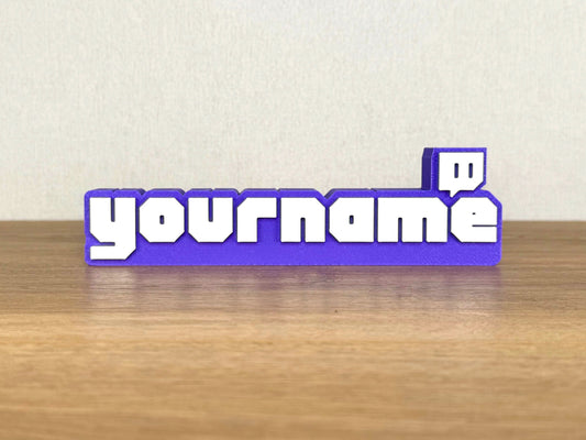 Picture of a twitch streamer name sign on a desk or bedroom table