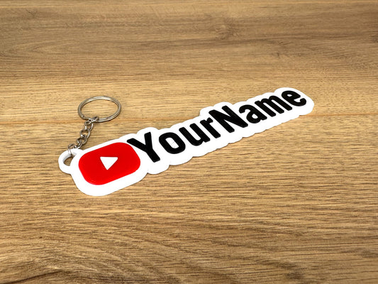 Picture of a personalised gift which is a keyring with the youtube logo on and a custom name